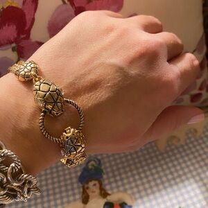 Gold tone snake bracelet